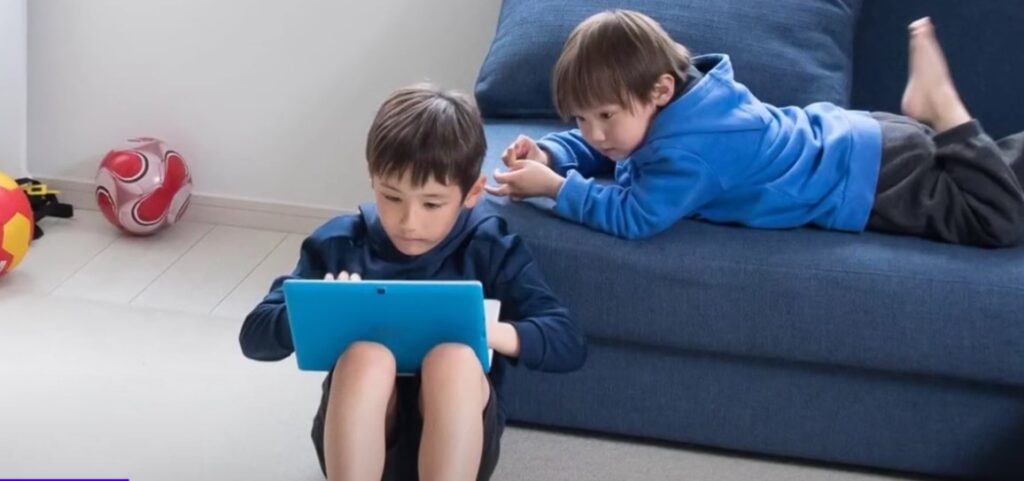kid is using laptop
